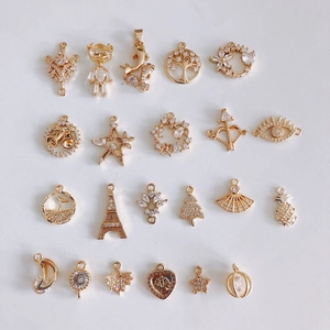 Detailed assortment of 21 gold-plated DIY jewelry pendants with sparkling zircon stones