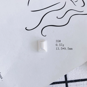 Macro detail of ivory resin rectangle cabochon for DIY jewelry making 13.5x9.5mm