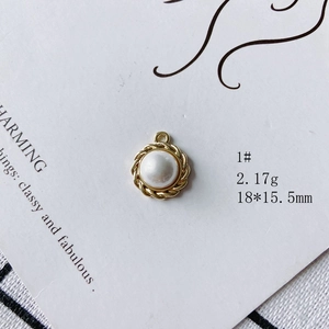 Detail of a round pearl pendant with gold metal rope texture border for DIY jewelry
