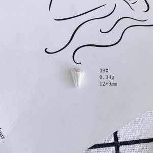 Macro shot of 12x9mm silver cone-shaped DIY metal charm with polished mirror finish