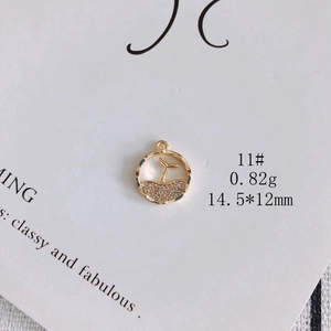 Detail of 14K gold plated whale tail pendant with rhinestones, size 14.5x12mm
