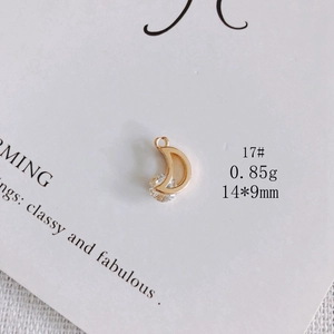 Detail of 14K gold plated crescent moon pendant with a sparkling round zircon stone