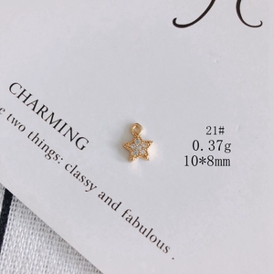 Close-up of gold star pendant with zircon inlay for DIY jewelry making accessories
