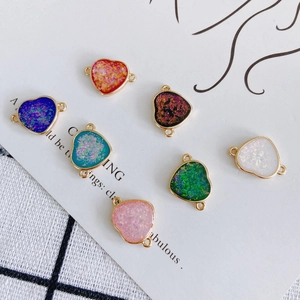Set of seven colorful heart charms with gold-plated edges and double loops for DIY jewelry