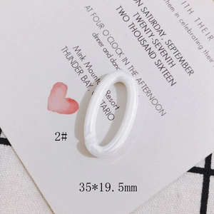 Detail view of a 35x19.5mm creamy white acrylic oval link for DIY jewelry crafting