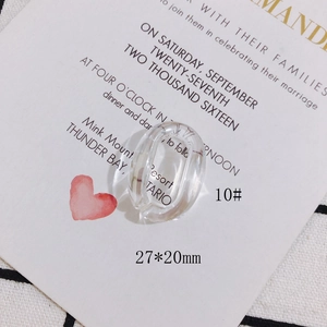 Detail of 27x20mm oval resin pendant with dried flower petals for DIY jewelry making
