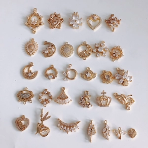 Macro shot of 18k gold plated brass charms with micro-pave cubic zirconia crystals