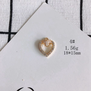 Detailed view of 18x15mm gold-plated heart pendant with zircon stones and square diamonds