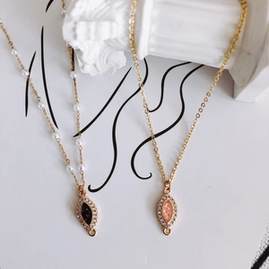 Gold-plated marquise resin pendant necklace with zircon border and beaded chain links