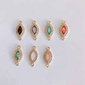 Detailed view of colorful marquise resin charms with gold plating and zircon inlay for DIY crafts