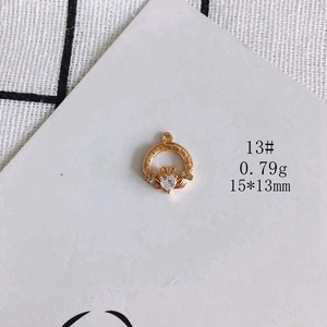 Macro shot of 15x13mm gold plated heart Claddagh pendant with zircon for DIY jewelry