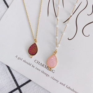 DIY gold-edged teardrop pendant necklaces with glitter inlay and small pearl accents