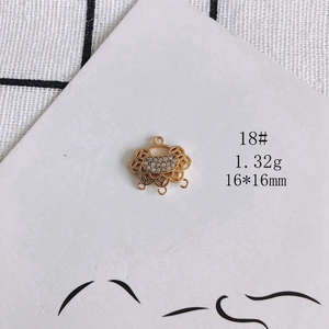 Macro view of a 16mm gold plated hollow lock pendant with white zircon for DIY jewelry