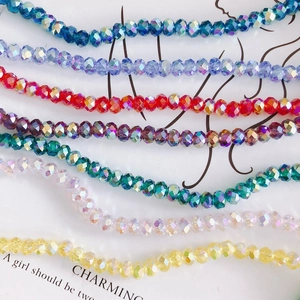 Colorful faceted crystal glass beads in vibrant wave patterns for DIY jewelry making