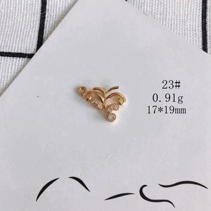 Macro view of a 17x19mm gold hollow heart pendant with white zircon for DIY jewelry making