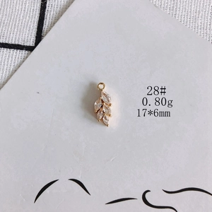 Detailed leaf pendant in gold plating with marquise cubic zirconia, 17x6mm size
