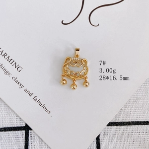 Macro detail of a 28x16.5mm gold hollow cloud pattern lock pendant with three mini bells