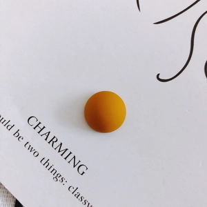 Detail view of 14mm matte mustard yellow geometric resin accessory for DIY phone cases