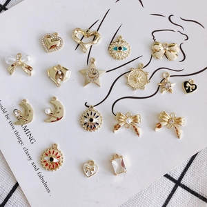 Charmes en Alliage Vintage DIY pour la Création de Bijoux Nœud Cœur Lune Mauvais Œil Étoile Avec Strass Künstliche Perle pour Collier Boucles d'Oreilles