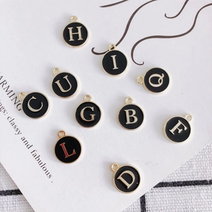 Set of 10 gold-plated round black enamel letter charms for DIY necklace making