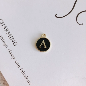 Macro detail of retro alloy alphabet A pendant with black enamel finish for DIY jewelry