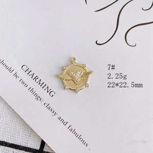 Detail of 22x22.5mm gold heart winged pendant with zircon inlays and 2.25g weight mark