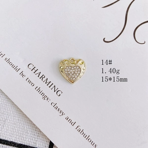 Detailed view of a gold heart pendant with inlaid pearls and diamonds, size 15*15mm