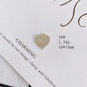 Detailed close-up of a heart-shaped pearl and diamond pendant measuring 16 by 14 mm