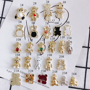 DIY jewelry charms set featuring 26 assorted gold bear and robot pendants with pearls