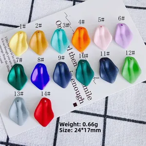 Flat lay of minimalist resin petal pendants in 14 colors for DIY jewelry making