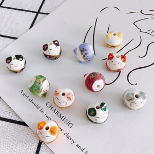 Handcrafted ceramic Maneki Neko lucky cat beads with gold detailing and top drill holes