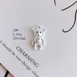 Macro shot of 23x13mm white astronaut bear pendant for DIY earring and necklace making