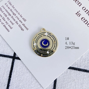 Detail of 28mm gold alloy moon and star enamel pendant for DIY jewelry making