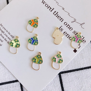 Seven-piece set of colorful alloy mushroom charms with floral enamel for DIY jewelry