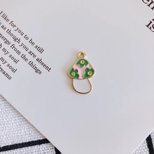 Detailed view of colorful enamel mushroom pendants for DIY jewelry earring making