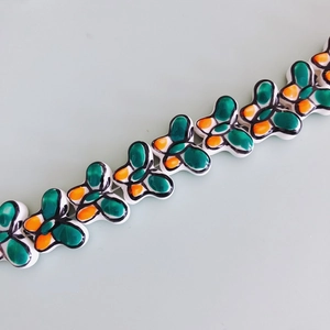 Macro detail of vibrant colorful butterfly ceramic beads for DIY handmade jewelry making
