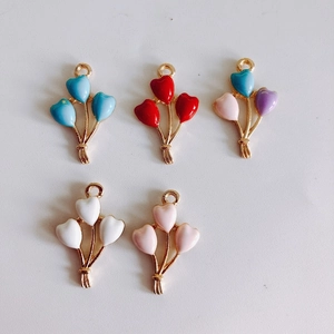 Detail showing five colorful alloy enamel heart balloon pendants for DIY jewelry making