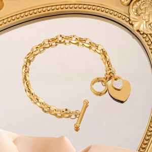 Golden titanium steel heart bracelet with OT clasp and sparkling crystal charms