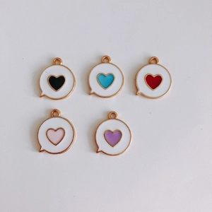 Detailed view of colorful heart enamel pendants in five colors for DIY jewelry crafting