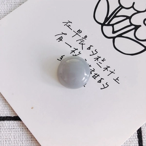 Flat round purple marble bead for DIY jewelry and phone case charms macro detail view