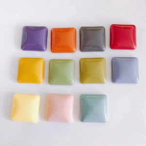 Macro shot of colorful square resin charms with glossy finish for DIY phone cases