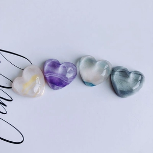 Set of four polished heart-shaped resin charms with vintage oil painting textures