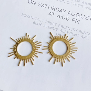 Golden sunburst charms for DIY jewelry making in brass with radiant line design
