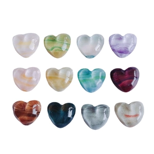 Polished heart-shaped stone charms in various mineral textures for DIY jewelry making