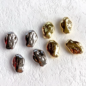 Irregular organic pebble-shaped metal beads in gold and silver finish for DIY jewelry