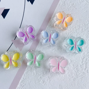 Breloques papillon en résine colorée aux tons pastels pour accessoires cheveux DIY