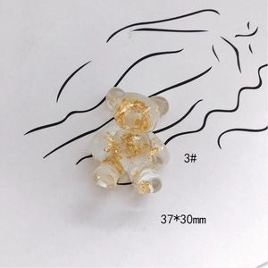 Macro shot of 37x30mm acrylic bear pendant with gold foil flakes for DIY jewelry