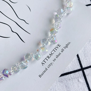 Macro shot of faceted crystal glass beads with AB rainbow coating for DIY jewelry