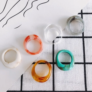 Set of six colorful translucent resin rings in minimalist vintage acrylic style