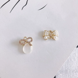 DIY bow-shaped charms with purple rhinestones and pearls for jewelry making